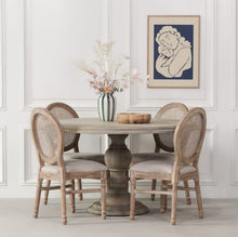 Load image into Gallery viewer, A beautifully handcrafted 147cm round dining table in a rustic finish, featuring a solid wood top and an elegant hand-carved columned pedestal base.
