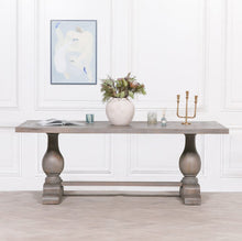 Load image into Gallery viewer, A handcrafted 210cm rectangular dining table made from solid mango wood, featuring a rustic finish with a subtle grey wash and elegant hand-carved columned pedestal bases.