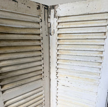 Load image into Gallery viewer, Pair of French vintage white wooden, chippy paint shutters which slot together perfectly