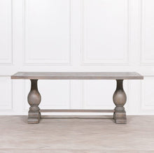 Load image into Gallery viewer, A handcrafted 210cm rectangular dining table made from solid mango wood, featuring a rustic finish with a subtle grey wash and elegant hand-carved columned pedestal bases.
