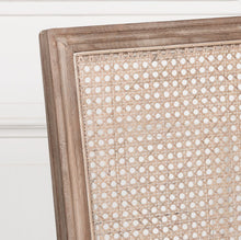 Load image into Gallery viewer, Elegant and timeless, this Wooden Louis Dining Chair features a carved birch frame with a subtle wood wash, a rattan square back, and a linen-upholstered seat, and is conveniently stackable.
