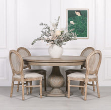 Load image into Gallery viewer, A handcrafted 150cm round dining table made from solid hardwood, finished in a dark rustic wash and featuring an intricately hand-carved pedestal base with acorn detailing.