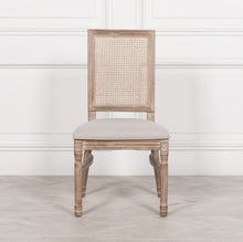 Load image into Gallery viewer, Elegant and timeless, this Wooden Louis Dining Chair features a carved birch frame with a subtle wood wash, a rattan square back, and a linen-upholstered seat, and is conveniently stackable.