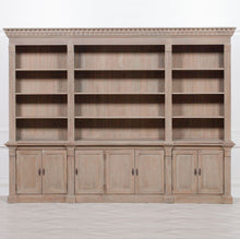 Load image into Gallery viewer, Large wooden bookshelf with multiple shelves and cabinets on a white background