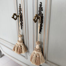 Load image into Gallery viewer, Vintage French Louis style sideboard painted in F&amp;B Lamp Room Grey with 2 stone lamps and decor on top against a light blue wall.