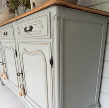 Load image into Gallery viewer, Vintage French Louis style sideboard painted in F&amp;B Lamp Room Grey with 2 stone lamps and decor on top against a light blue wall.