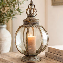Load image into Gallery viewer, A round glass and metal lantern which can hold pillar candle