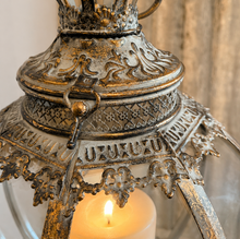 Load image into Gallery viewer, A round glass and metal lantern which can hold pillar candle