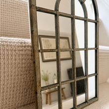 Load image into Gallery viewer, Decorative mirror with a rustic frame leaning against a textured wall.